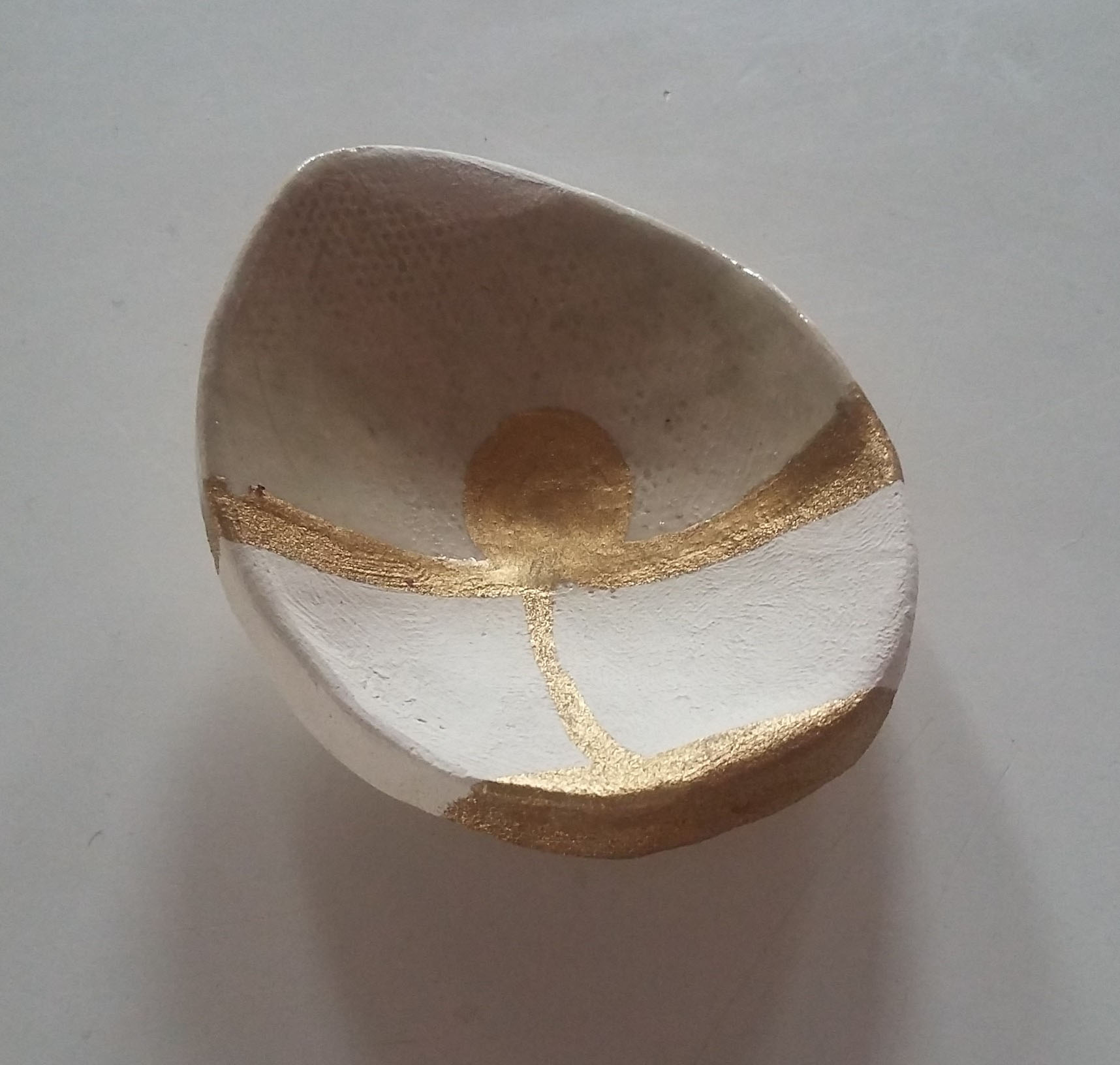 Miniature ceramic vessel.