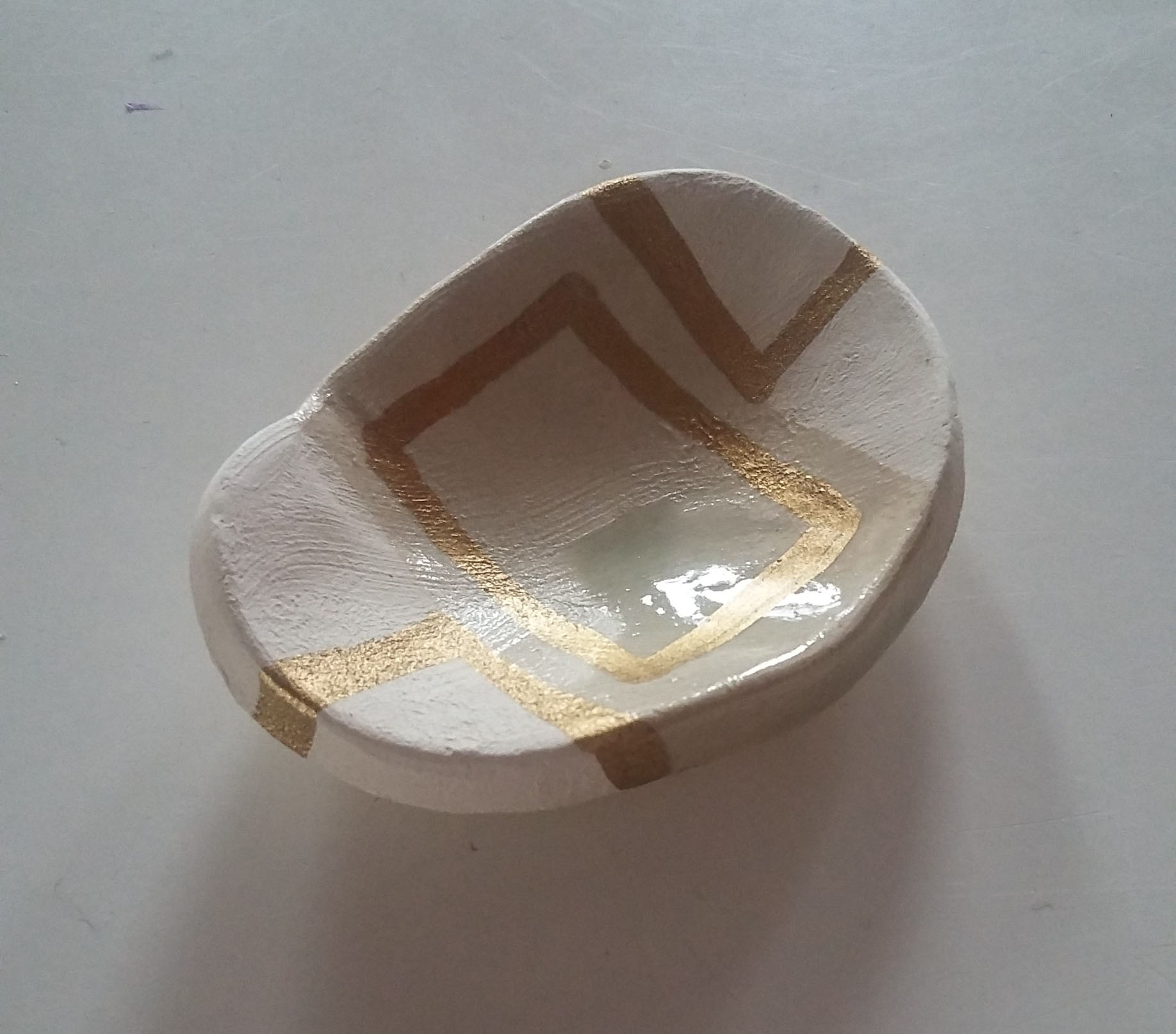 Miniature ceramic pot.